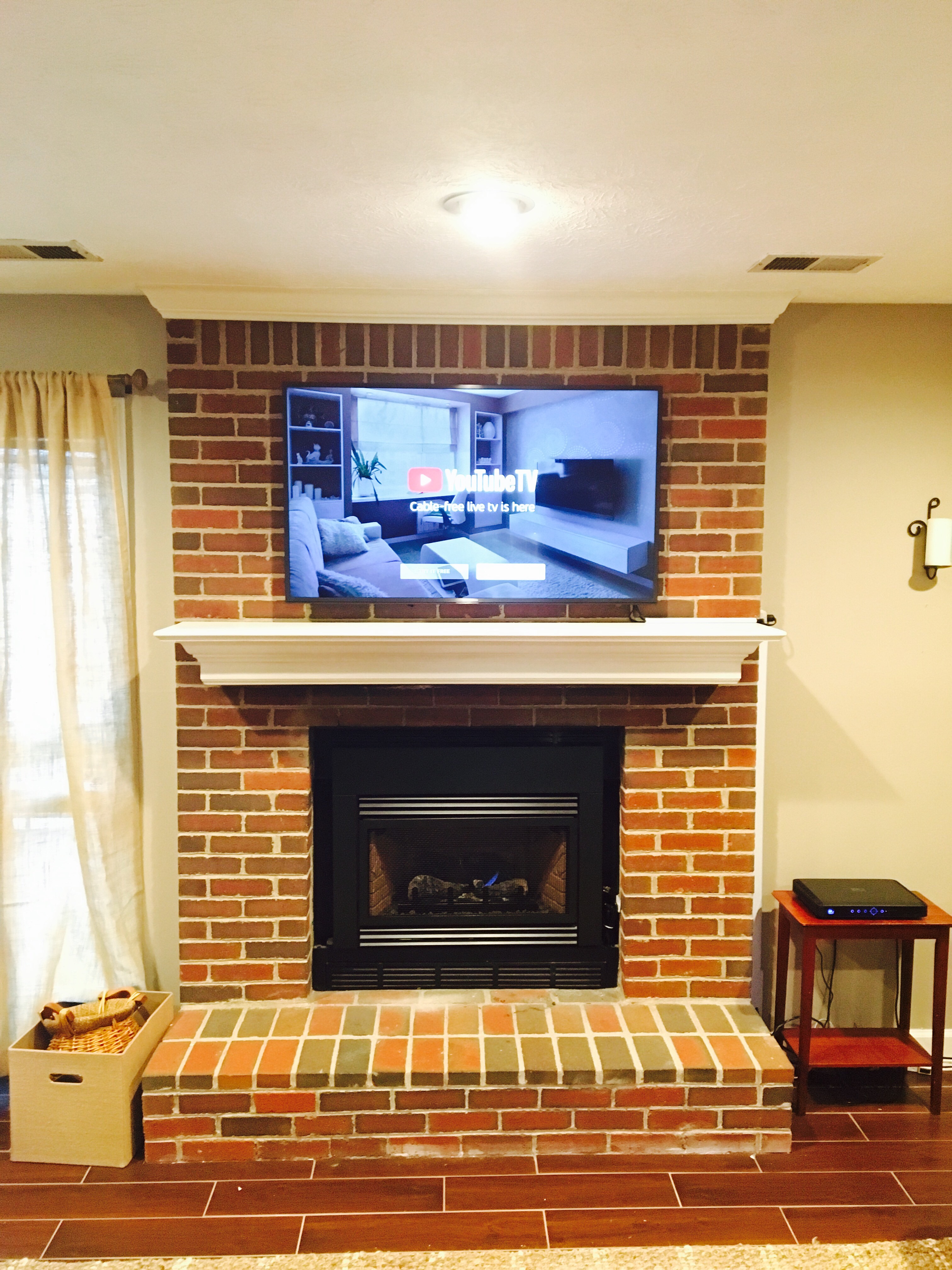 Tv Mounted On A Brick Fireplace In, Install Flat Screen On Brick Fireplace